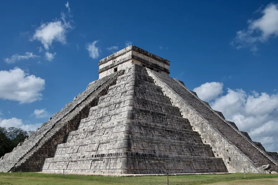 Ancient Mayan pyramid surrounded by jungle
