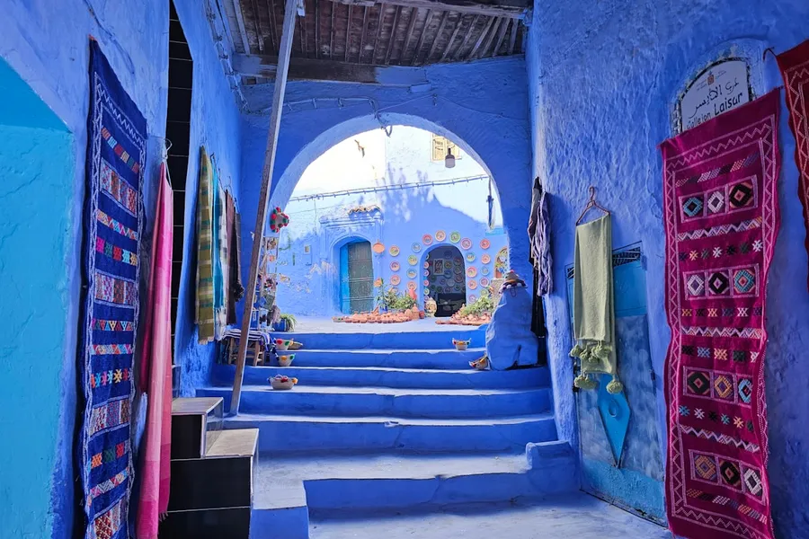 Narrow alley in a Moroccan medina with colourful walls